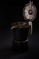 Isolated Coffee maker closeup on black background