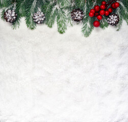 Obraz na płótnie Canvas Snow background with fir branches and pine cones. Christmas decoration.