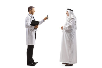 Young doctor showing a mobile phone to a mature male arab patient