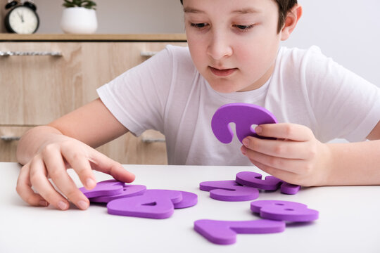 A boy learning math, count exercises at home - Powered by Adobe