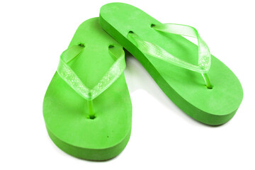 green rubber beach flip flops on a white background, isolate