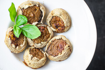 mushroom stuffed vegetables mushrooms baked no meat fresh portion ready to eat meal snack on the table copy space food background rustic. top view keto or paleo diet veggie vegan or vegetarian