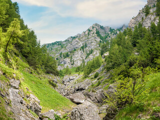 Fototapeta na wymiar Scenic landscape in Bucegi Mountains from Jepii Mici trail, a popular hiking path Carpathian Mountains, Romania.