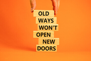 Old ways do not open new doors symbol. Wooden blocks with words 'Old ways do not open new doors'....