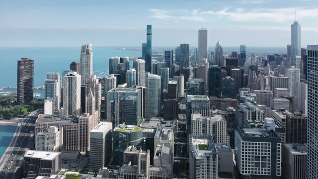 4K aerial overview of Chicago Downtown. Beautiful business and residential buildings at the frontline. Expensive apartments in the skyscrapers with scenic Michigan lake view in Illinois, USA