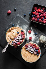 Ryazhenka mousse in glass bowls decorated with fresh berries