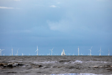 yacht and wind turbines on North sea