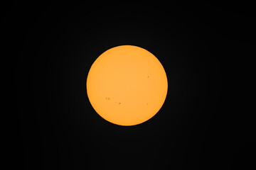 Centered view of the Sun with many active sunspot regions seen in Dublin, Ireland on 7 September, 2021. Image captured with use of telephoto lens and solar eclipse filter