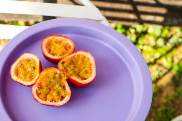 Fresh Purple passion fruit (Passiflora edulis) on plate.