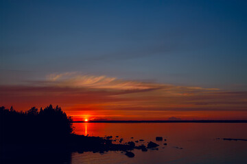 Colorful sunset on Lake Pongoma, North Karelia, Russia