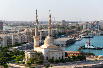 Fototapeta na wymiar An Egyptian Mosque and maritime port at the city of Tawfiq (Suburb of Suez), on the southern end of the Suez Canal before exiting into the Red Sea. 