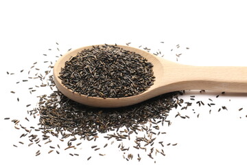Bird niger seed in wooden spoon (Guizotia abyssinica) isolated on white background