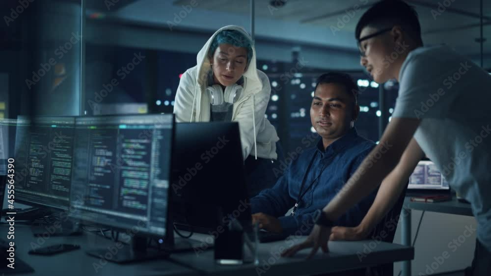 Poster Diverse Team of Professionals Meeting in Office at Night: Brainstorming IT Programmers Use Computer Together, Talk Strategy, Discuss Planning. Software Engineers Develop Inspirational App Program