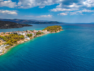 Fototapeta na wymiar Aerial panoramic photo of picturesque seaside town of Ermioni built in peninsula with forest of Bistis at the end, Argolida, Peloponnese, Greece