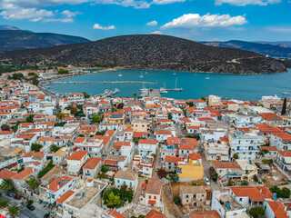 Naklejka na ściany i meble Aerial panoramic photo of picturesque seaside town of Ermioni built in peninsula with forest of Bistis at the end, Argolida, Peloponnese, Greece