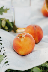 Wedding rings on peaches 