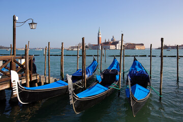 Gondolas in St. Mark's square with Saint George's island, Venice, Italy