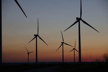 Wind Turbines producing energy at sunset