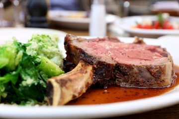 Gorgeous  steak and vegetables on a plate at the restaurant.