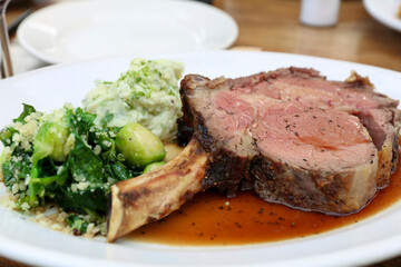Gorgeous  steak and vegetables on a plate at the restaurant.