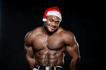 Waist up portrait of the african american bodybuilder man with shirtless muscular torso. Male...