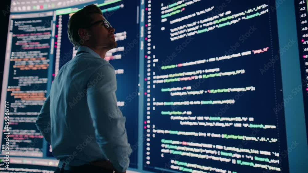 Poster Innovative Startup Concept: Thoughtful Software Engineer Finding Solution, Planning Strategy, Standing and Doing Data Analysis on Big Wall Screen. Programmer Developing e-Commerce App. Handheld