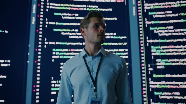 Innovative Startup Eureka Moment: Portrait of Brilliant Software Engineer Finding Solution, Doing Big Data Analysis. Big Screen Background. Computer Science Programmer Developing App.Cinematic Zoom In