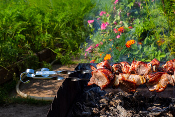 The process of cooking shish kebab.