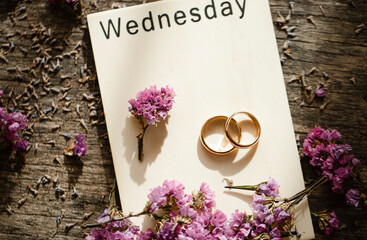 wedding bouquet on the table. Wedding rings 