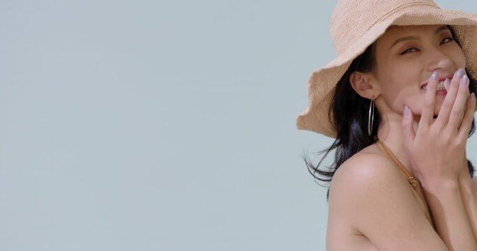 Young woman in bikini wearing sun hat,4K