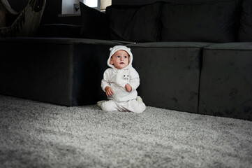 Happy beautiful baby walks and learns to crawl