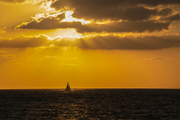 Fototapeta premium A Aailboat at Sunset Time