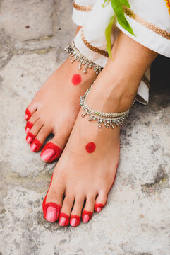 Cropped image of woman's henna feet
