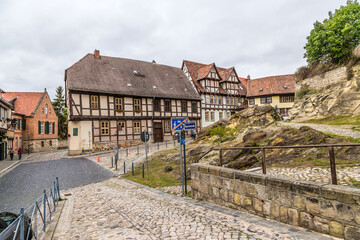 Fototapeta na wymiar Quedlinburg, Germany. Half-timbered buildings at the foot of the castle hill 