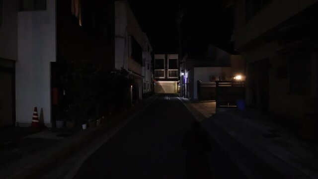 Night walking on street in Japan. POV gimbal shot