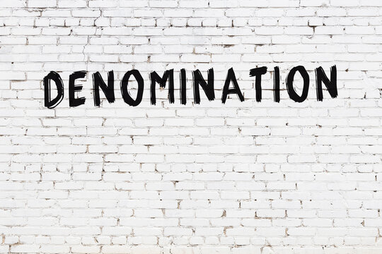Inscription denomination painted on white brick wall