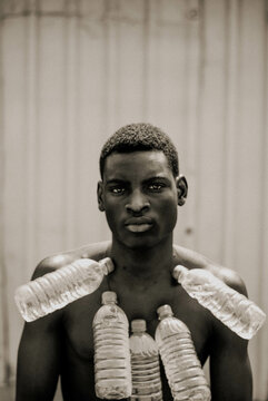 Grayscale Portrait of man with plastic bottle necklace