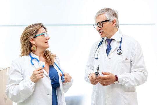 Portrait Of Couple Of Doctors In A Moment Of Break In A Clinic