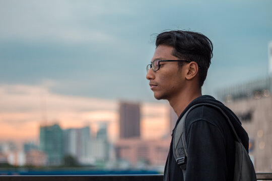 Man wearing eyeglasses and jacket near citi horizon