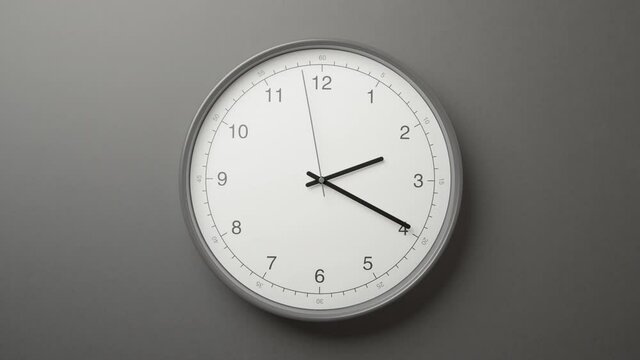 Clock Face on Dark Grey Office Wall in Timelapse