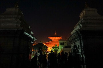 People gathering at Pashupatinath Temple in Nepal during nigh