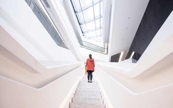Person standing inside of a building