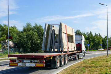 transportation of reinforced concrete precast wall panels for house construction by truck
