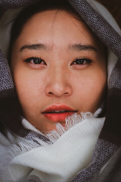 Portrait of woman in light scarf