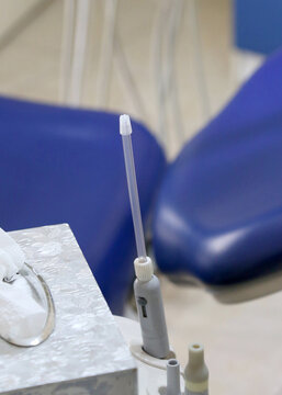 Saliva ejector on dentistry chair