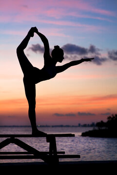 Silhouette photography of woman doing yoga during sunset