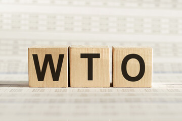 WTO - World Trade Organization, on wooden cubes on a light background.