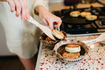 Woman baking bread on a pan