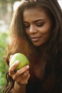 Woman Eating A Green Apple