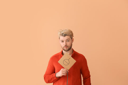 Non-binary young man on color background